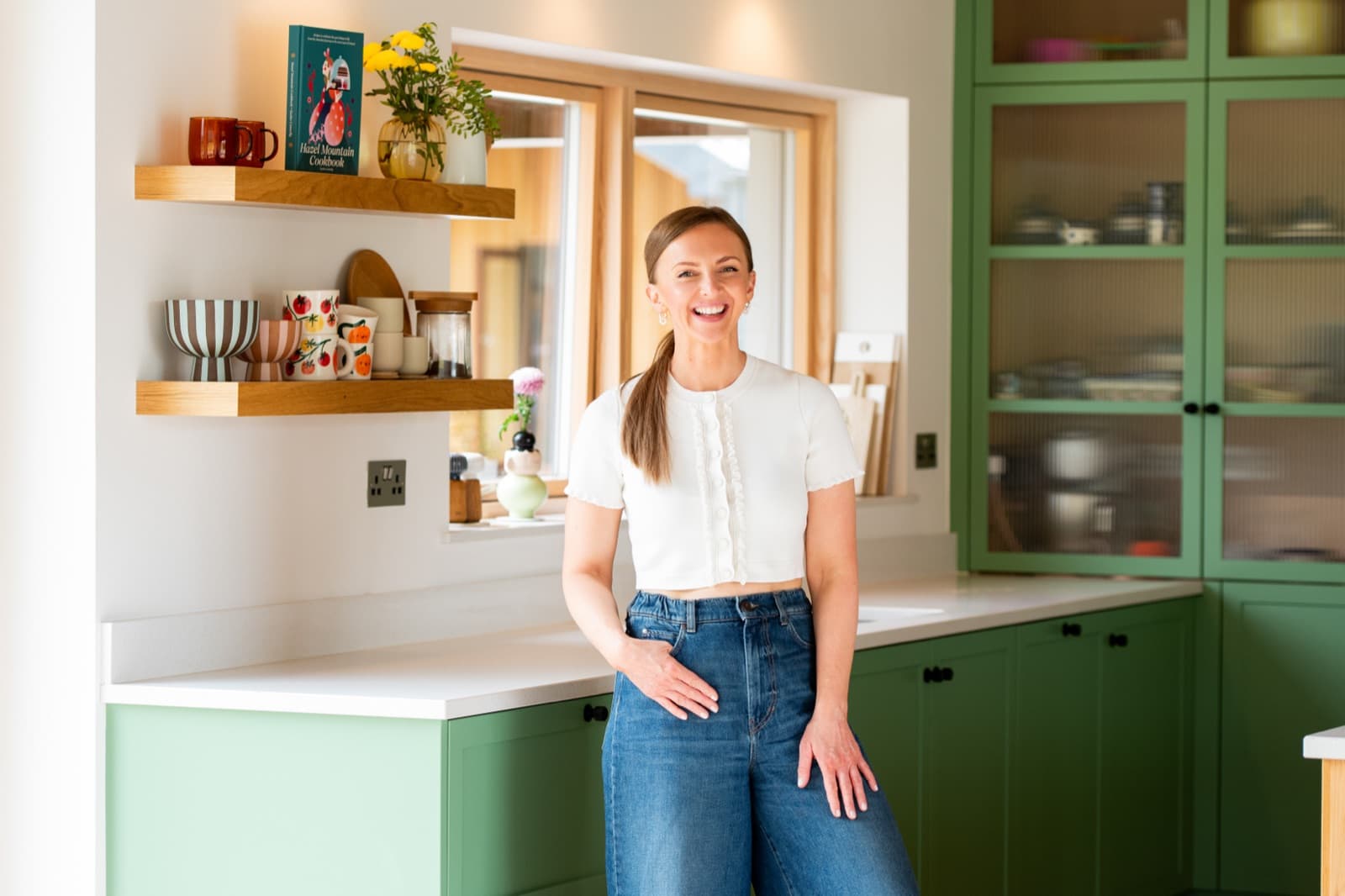 Kasha in the sage-green kitchen at The Chocolate Lodge
